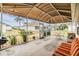 Covered screened porch with seating and outdoor table at 3096 Lansing Way, The Villages, FL 32162