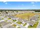 Aerial view showcasing home's location in a residential neighborhood at 8638 Triumph Cir, Wildwood, FL 34785