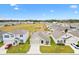 One story house, aerial view showing surrounding homes at 8638 Triumph Cir, Wildwood, FL 34785