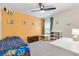 bedroom with a twin bed and playful decor at 8638 Triumph Cir, Wildwood, FL 34785