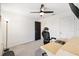 Spacious bedroom with a desk and window at 8638 Triumph Cir, Wildwood, FL 34785