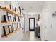 Light and airy entryway with floating shelves and a modern console table at 8638 Triumph Cir, Wildwood, FL 34785
