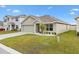 One story house with a two car garage and nicely landscaped yard at 8638 Triumph Cir, Wildwood, FL 34785