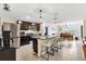 Modern kitchen with granite countertops and stainless steel appliances at 8638 Triumph Cir, Wildwood, FL 34785