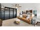Living area with built-in shelving and a comfortable leather couch at 8638 Triumph Cir, Wildwood, FL 34785