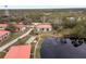 Aerial view of condo community near lake with shuffleboard at 3004 Granada Ct # 3004, Lake Wales, FL 33898