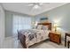 Bedroom with a queen-size bed and wood furniture at 3004 Granada Ct # 3004, Lake Wales, FL 33898