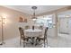 Dining area with round table and chairs, open to the kitchen at 3004 Granada Ct # 3004, Lake Wales, FL 33898