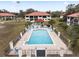 Community pool with surrounding patio furniture at 3004 Granada Ct # 3004, Lake Wales, FL 33898