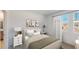 Bedroom with a queen bed, gray bedding and white nightstand at 4154 Jespersen St, Apopka, FL 32712