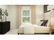 Bedroom with a bed, neutral color scheme, and plenty of natural light at 4192 Singing Mockingbird Blvd, Bartow, FL 33830