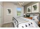 Secondary bedroom with a window and stylish decor at 5423 Sw 85Th Avenue Rd, Ocala, FL 34481