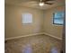 Bedroom with tiled floors and window blinds at 112 Jasper St, Bushnell, FL 33513