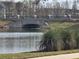 Scenic view of a bridge over water, framed by lush greenery and a tranquil body of water at 2157 Geneva Dr, Lakeland, FL 33805