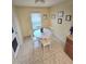 Small dining area with white table and chairs at 2157 Geneva Dr, Lakeland, FL 33805