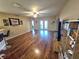 Living room with hardwood floors, and access to backyard patio at 2157 Geneva Dr, Lakeland, FL 33805