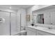 Modern bathroom with a double vanity and walk-in shower at 251 Puma Loop, Groveland, FL 34736