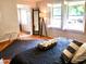 Bedroom with a king-size bed and a wooden tray at 311 N Baker St, Mount Dora, FL 32757