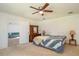 Spacious Primary bedroom with a ceiling fan and dresser at 10984 Sw 81St Ave, Ocala, FL 34481