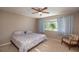 Spacious bedroom with king-size bed and ceiling fan, offering plenty of room at 10984 Sw 81St Ave, Ocala, FL 34481