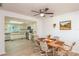 Dining area with wood table and chairs, open to kitchen at 10984 Sw 81St Ave, Ocala, FL 34481