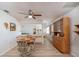 Dining room with wood hutch and table for four, adjacent to kitchen at 10984 Sw 81St Ave, Ocala, FL 34481