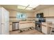 Well-equipped kitchen with stainless steel appliances and light cabinets at 10984 Sw 81St Ave, Ocala, FL 34481