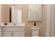 Clean bathroom with white vanity, bathtub, and shower at 290 Puma Loop, Groveland, FL 34736