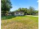 Ranch style home with a well-manicured lawn at 5018 Se 106Th Pl, Belleview, FL 34420