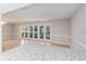 Bright living room with tile floors and sliding glass doors leading to the backyard at 5018 Se 106Th Pl, Belleview, FL 34420