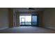 Spacious living room with sliding doors leading to a view at 2491 Harwich Dr, Kissimmee, FL 34741