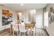 Bright dining room with wooden table and white chairs at 3468 Dahlia Dr, Lake Hamilton, FL 33851