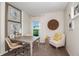 Bright home office features a spacious desk, comfortable chair, and large window at 3468 Dahlia Dr, Lake Hamilton, FL 33851