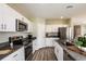 Modern kitchen with white cabinets, stainless steel appliances and an island at 3468 Dahlia Dr, Lake Hamilton, FL 33851
