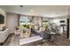 Open concept living space with gray sofa and adjoining kitchen at 3468 Dahlia Dr, Lake Hamilton, FL 33851