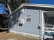 Gray house exterior with window and A/C unit at 1268 Cr 436, Lake Panasoffkee, FL 33538