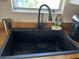 Modern black sink with pull down faucet at 1268 Cr 436, Lake Panasoffkee, FL 33538