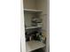 Well-organized linen closet with ample shelving at 1268 Cr 436, Lake Panasoffkee, FL 33538