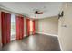 Bright bedroom with wood floors and orange curtains at 2019 Dixie Belle Dr # 2019X, Orlando, FL 32812