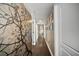 Long hallway with wood floors and artistic wall decor at 2019 Dixie Belle Dr # 2019X, Orlando, FL 32812