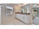 Double vanity bathroom with granite countertop and white cabinets at 2954 Flying Blackbird Rd, Bartow, FL 33830