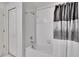 Simple bathroom with white tile and shower/tub combo at 2954 Flying Blackbird Rd, Bartow, FL 33830