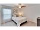 Cozy bedroom with a queen-size bed and window at 2954 Flying Blackbird Rd, Bartow, FL 33830