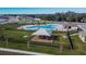 Aerial view of community pool, playground, and shaded seating areas at 2954 Flying Blackbird Rd, Bartow, FL 33830