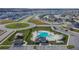 Community pool with surrounding deck and playground at 2954 Flying Blackbird Rd, Bartow, FL 33830