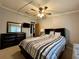 Bedroom with ceiling fan and dresser at 3109 Sand Trap Ct, Lakeland, FL 33810