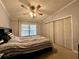 Bright bedroom with ceiling fan and sliding doors at 3109 Sand Trap Ct, Lakeland, FL 33810