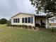 Ranch home with neat landscaping and a side patio at 3109 Sand Trap Ct, Lakeland, FL 33810