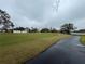 View of a serene golf course with a paved pathway at 3109 Sand Trap Ct, Lakeland, FL 33810