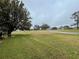 Landscaped yard with view of a lush green golf course at 3109 Sand Trap Ct, Lakeland, FL 33810